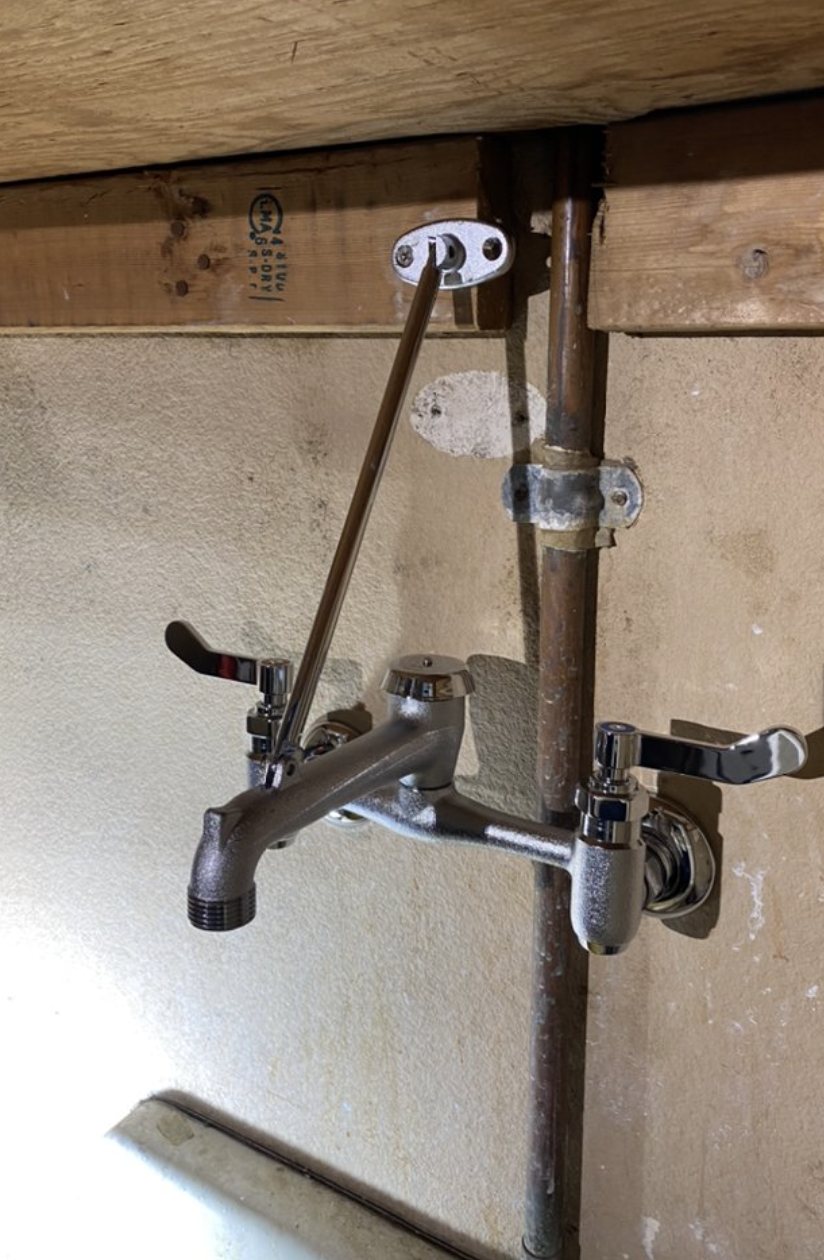 A new chrome utility-sink faucet installed by Geyser Plumbing